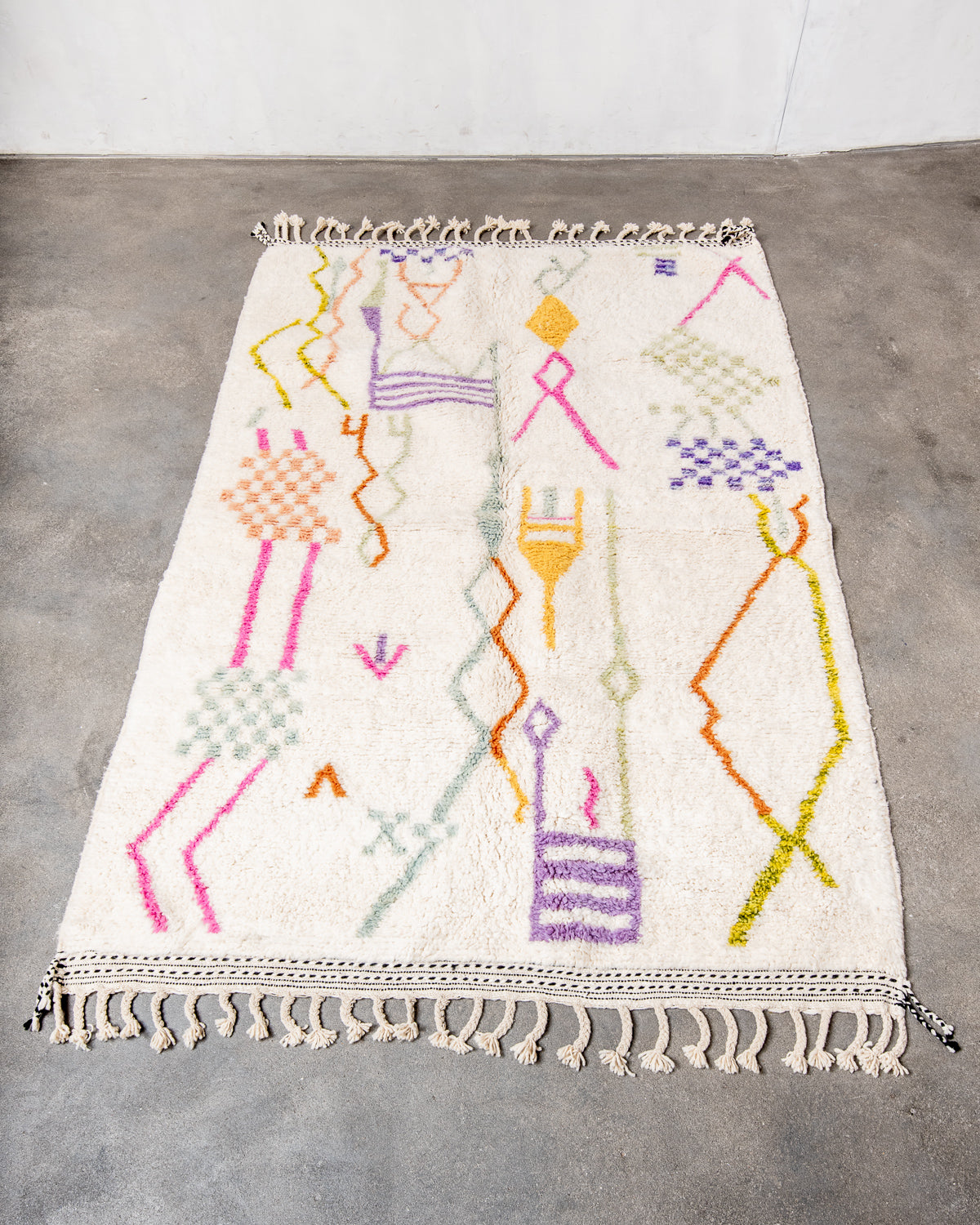 Modern, designer, handcrafted Berber rug from Morocco. Beniourain carpet with beautiful colours and patterns and fluffy wool texture.